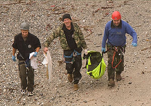 Dan heading back up the cliff with BDMLR
(left to right:- Dan, Tim and Chris)