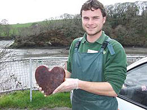 Dan holding a heart-shaped edible treat