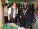 Sarah Vine, the Sanctuary's Attraction Manager and the Mayor of Helston look at the interactive rescue volunteer section